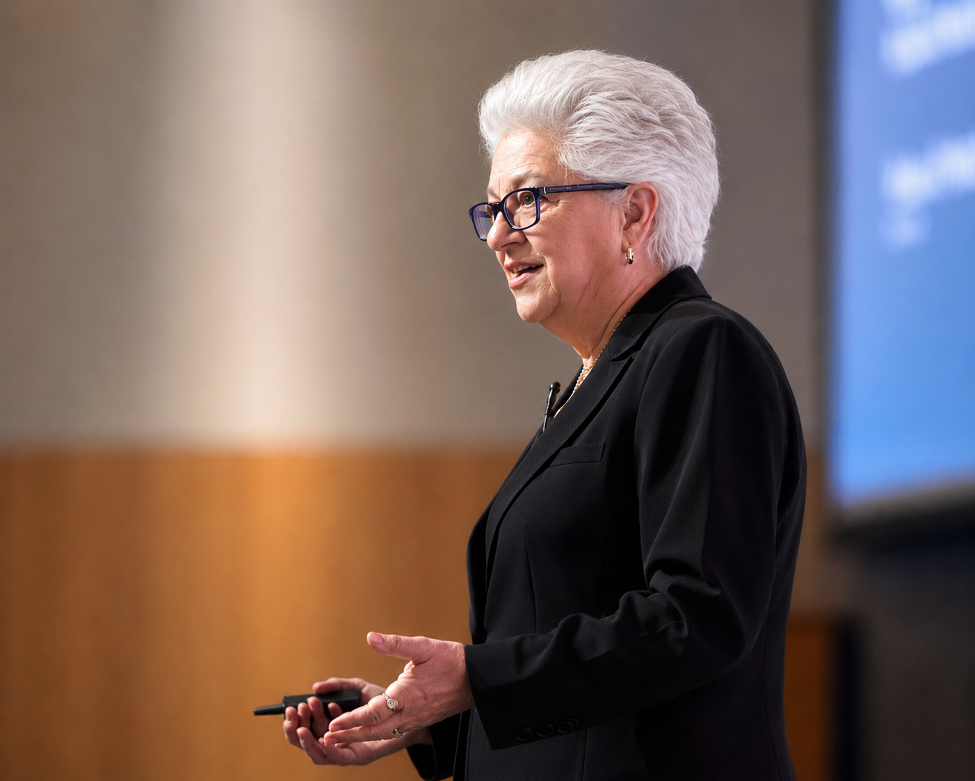 Michelle Causton presenting on stage — founder of BZMind