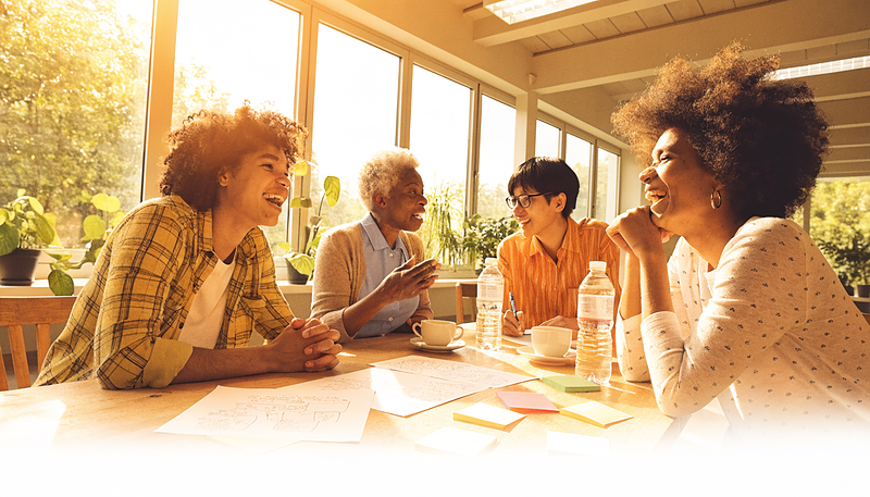 A small group meeting around a table, planning together — Starting a Community Not-for-Profit course